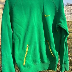 Nike Men's Green Sweatshirt Hoodie with Yellow and Pink Accents.
